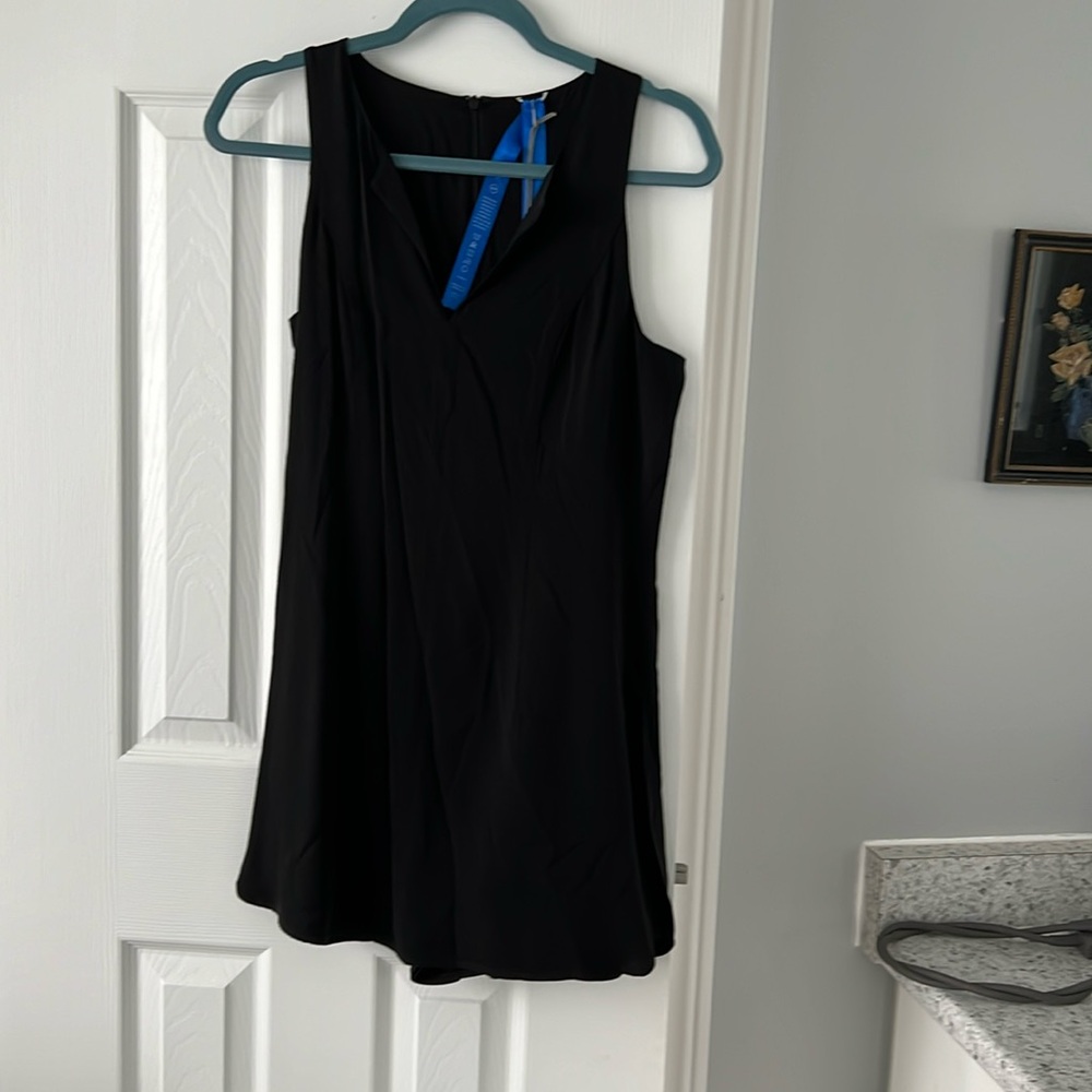 Kit and Ace “Hide and sleek” romper. Sleeveless with skort. Black size 6 NWT
